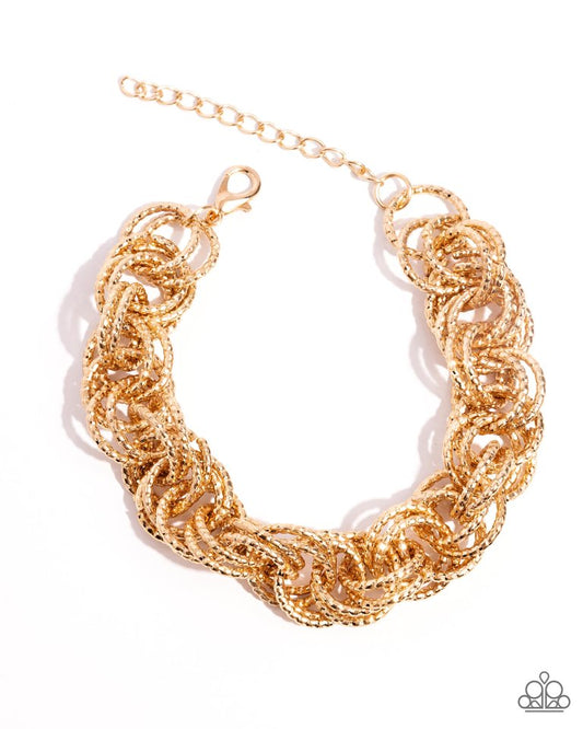 Audible Shimmer - Gold - Paparazzi Bracelet Image