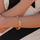 Symmetrical Sheen - Gold - Paparazzi Bracelet Image