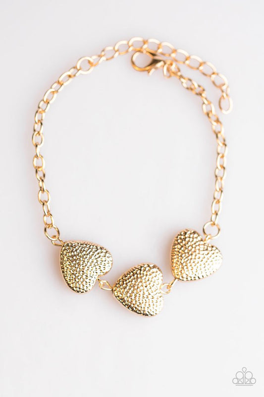 Pulsera Paparazzi ~ Corazón duro - Oro