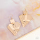 ​Deceivingly Deco - Gold - Paparazzi Earring Image