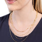 Studded Shimmer - Gold - Paparazzi Necklace Image